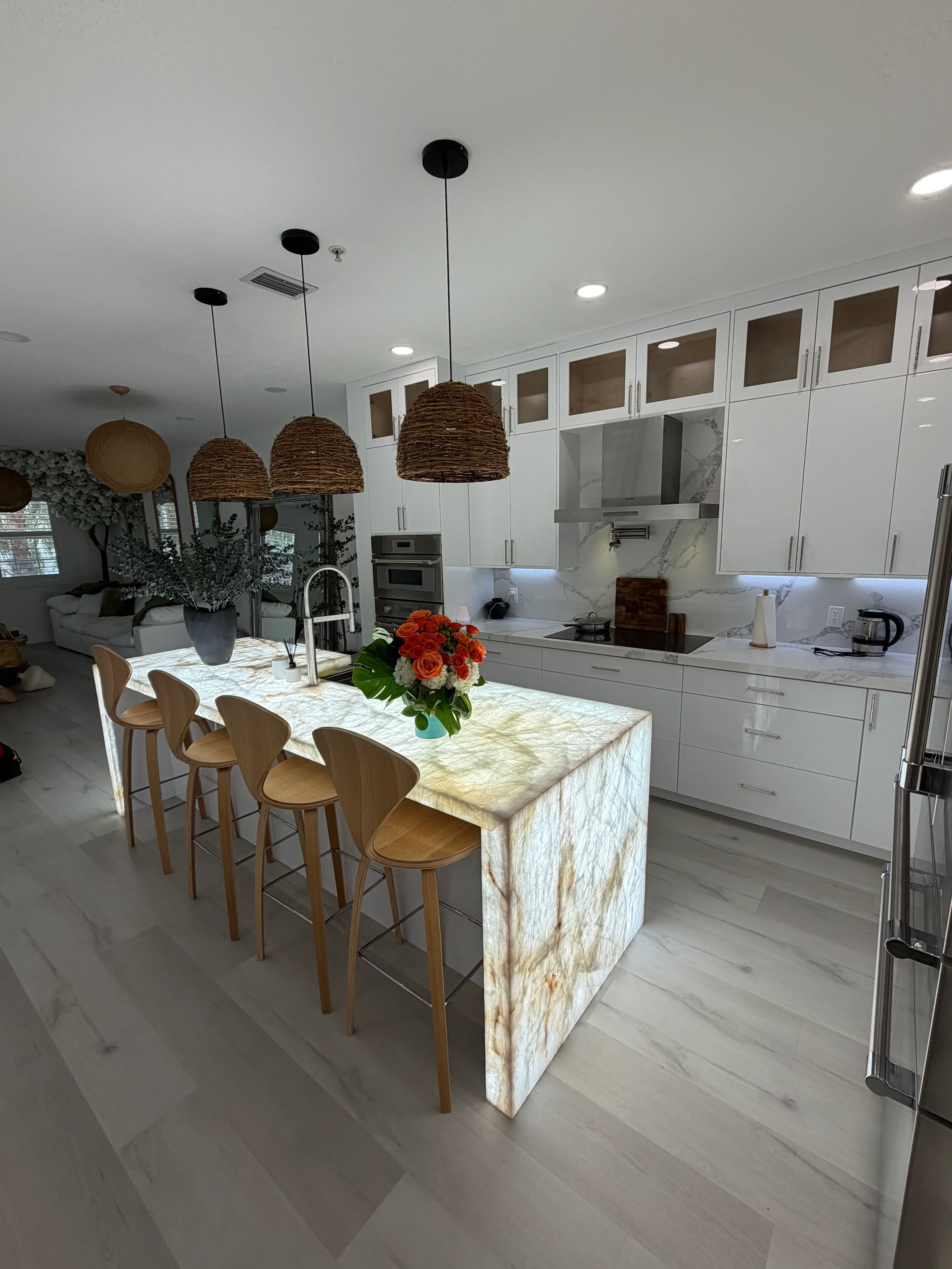 Newly remodeled kitchen with custom cabinets, granite countertops, and island seating